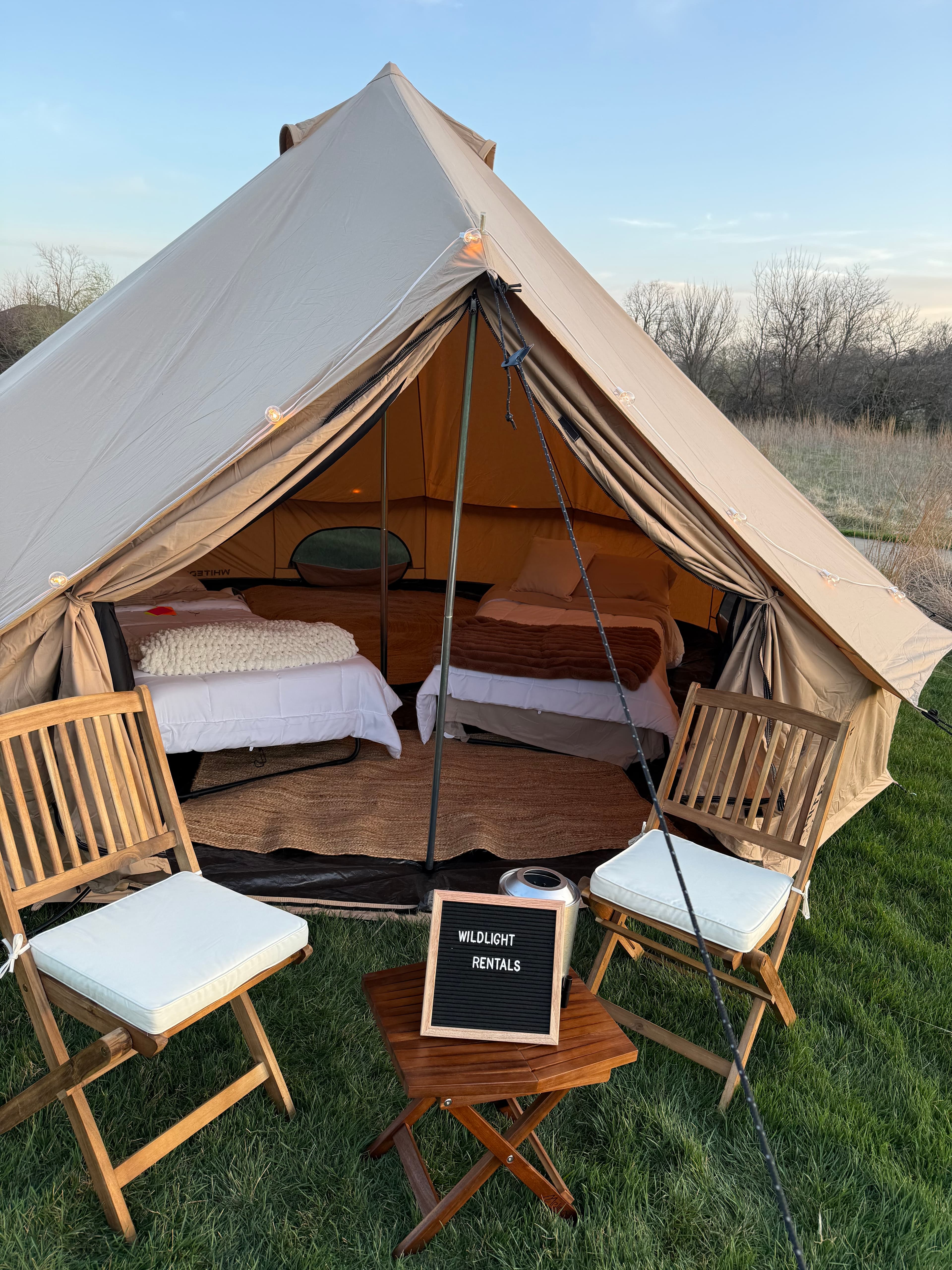 Front view of the bell tent with chairs out front